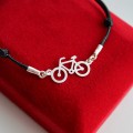 srebrna bransoletka na sznurku rower 925